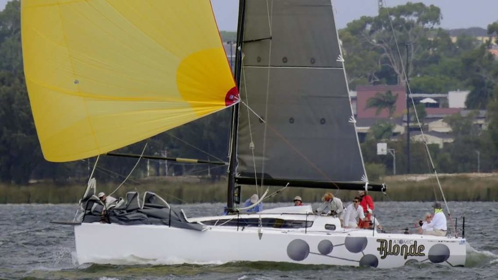 AB under spinnaker on Swan River